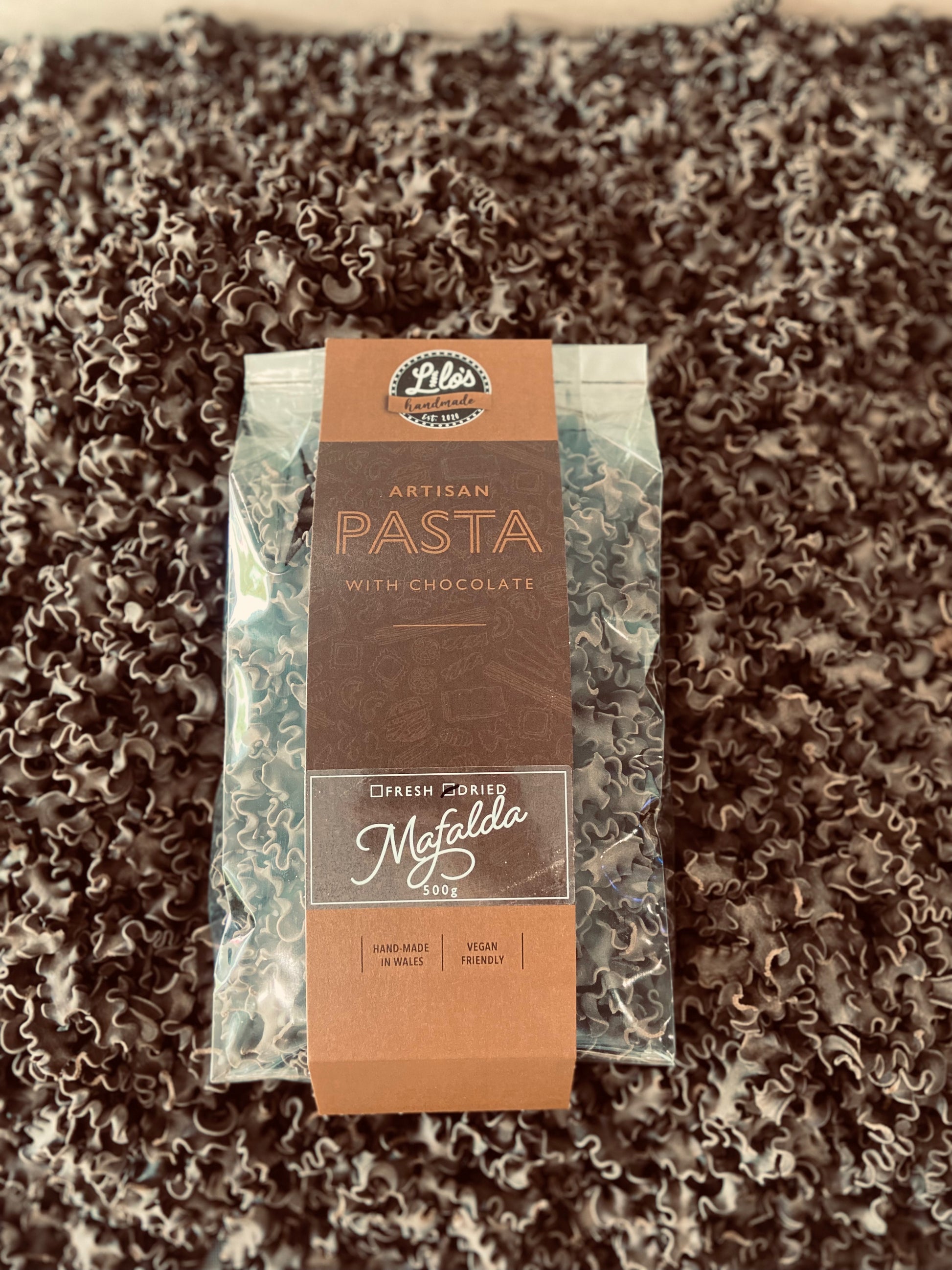Pasta package with chocolate on a textured surface